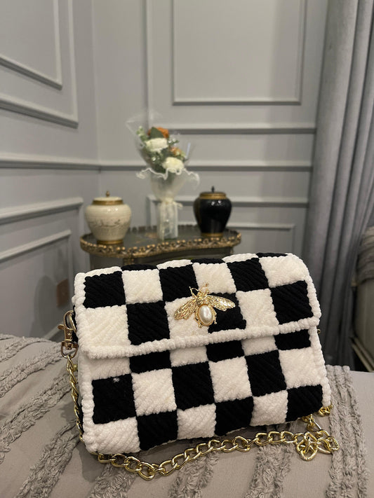 Black & White Checkered Woven Shoulder Bag with Gold Bee Brooch